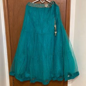 Indian traditional lehnga choli dress with net dupatta . It is a two piece dress